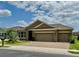 Exterior shot of a home featuring a three car garage and brick-paved driveway at 274 Brunswick Dr, Davenport, FL 33837