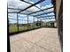 Spacious screened lanai with brick flooring and views of backyard at 274 Brunswick Dr, Davenport, FL 33837