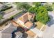 Aerial view of suburban residence with red fence, two car garage, screened in pool, and mature landscaping at 2780 Running Springs Loop, Oviedo, FL 32765