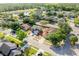 An elevated street view of a two-story house, surrounded by a residential neighborhood, trees, and lawns at 2780 Running Springs Loop, Oviedo, FL 32765