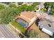 Aerial view of home, mature foliage, and screened-in pool, within residential neighborhood at 2780 Running Springs Loop, Oviedo, FL 32765