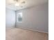 Cozy bedroom with neutral colored walls, ceiling fan, and a window at 2780 Running Springs Loop, Oviedo, FL 32765