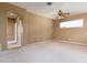 Spacious bedroom with neutral tones, ceiling fan, and natural light from window at 2780 Running Springs Loop, Oviedo, FL 32765