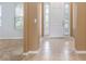 Inviting foyer with tile flooring, neutral walls, and a view into the adjacent living area at 2780 Running Springs Loop, Oviedo, FL 32765