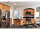Modern kitchen showcasing stainless steel appliances, granite counters, and an island for food preparation at 2780 Running Springs Loop, Oviedo, FL 32765