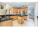 Well-appointed kitchen with an island, granite countertops, stainless steel appliances, and ample cabinetry at 2780 Running Springs Loop, Oviedo, FL 32765