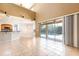 Spacious living room with tile flooring, high ceilings, and sliding glass doors leading to the pool area at 2780 Running Springs Loop, Oviedo, FL 32765