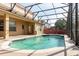 Inviting screened-in pool featuring a sparkling blue surface and surrounding patio area with exterior access at 2780 Running Springs Loop, Oviedo, FL 32765