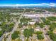 Aerial view showcasing the city skyline and the property's proximity to shopping centers and the nearby pond at 288 N Seneca St, Daytona Beach, FL 32114