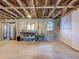 Unfinished basement with exposed beams and cinderblock walls, offering a blank canvas for customization and expansion at 288 N Seneca St, Daytona Beach, FL 32114