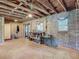 Unfinished basement with exposed beams and cinderblock walls, offering a blank canvas for customization and expansion at 288 N Seneca St, Daytona Beach, FL 32114