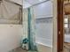 Bathroom featuring white subway tile and a mosaic tile accent in the shower at 288 N Seneca St, Daytona Beach, FL 32114