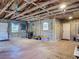 Spacious garage with concrete walls, wooden frame and ample room for storage and projects at 288 N Seneca St, Daytona Beach, FL 32114