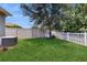 Large, well-maintained backyard featuring lush green grass and privacy fence at 2952 Boating Blvd, Kissimmee, FL 34746