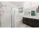 Elegant bathroom with a shower, tub, vanity, and bright lighting fixtures at 2952 Boating Blvd, Kissimmee, FL 34746