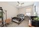Cozy bedroom with ceiling fan, carpet, and a window providing natural light at 2952 Boating Blvd, Kissimmee, FL 34746