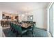 Elegant dining room with seating for ten and views into the open kitchen at 2952 Boating Blvd, Kissimmee, FL 34746