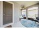 Welcoming screened-in front porch, featuring a ceiling fan and comfortable seating area at 2952 Boating Blvd, Kissimmee, FL 34746
