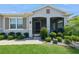 Inviting front porch with screen door, landscaping, and exterior architectural features at 2952 Boating Blvd, Kissimmee, FL 34746
