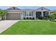 Charming single-story home with a well-manicured lawn and welcoming curb appeal at 2952 Boating Blvd, Kissimmee, FL 34746