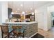 Contemporary kitchen featuring a breakfast bar and stainless steel appliances at 2952 Boating Blvd, Kissimmee, FL 34746