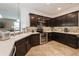 Well-equipped kitchen boasting dark wood cabinetry and stainless steel appliances at 2952 Boating Blvd, Kissimmee, FL 34746