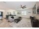 Bright, open living area featuring modern decor and seamless access to the dining area at 2952 Boating Blvd, Kissimmee, FL 34746