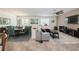 Open-concept living room with dining area featuring tile floors and ample natural light at 2952 Boating Blvd, Kissimmee, FL 34746
