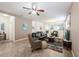 Spacious living room with tile flooring, comfortable seating, and neutral paint at 2952 Boating Blvd, Kissimmee, FL 34746