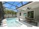 Beautiful screened-in pool with outdoor dining area provides the perfect space for relaxation and entertainment at 2952 Boating Blvd, Kissimmee, FL 34746
