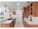 Traditional kitchen featuring wood cabinetry, granite countertops, and stainless steel appliances at 3385 Lake Harney Cir, Geneva, FL 32732