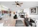 Open-concept living room featuring fireplace, high ceilings, and natural light at 3385 Lake Harney Cir, Geneva, FL 32732