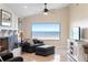 Cozy living room showcasing a picturesque water view from a large window at 3385 Lake Harney Cir, Geneva, FL 32732