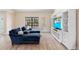 Bright and airy living room with plush seating and a large entertainment center at 3385 Lake Harney Cir, Geneva, FL 32732