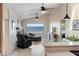 Open concept living room featuring tile floors, white brick wall and a view of the water at 3385 Lake Harney Cir, Geneva, FL 32732