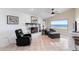 Inviting living room with a fireplace, comfortable seating, and scenic waterfront views at 3385 Lake Harney Cir, Geneva, FL 32732