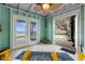Covered patio with serene water views, comfortable seating, and lots of sunshine at 3385 Lake Harney Cir, Geneva, FL 32732
