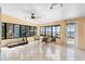 Bright sunroom featuring water views, tile flooring, and room for exercise equipment at 3385 Lake Harney Cir, Geneva, FL 32732