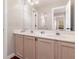 Bathroom featuring a double sink vanity and a large mirror at 343 Raleigh Pl, Oviedo, FL 32765