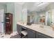 Spacious bathroom with double vanity, large mirror, and elegant fixtures at 343 Raleigh Pl, Oviedo, FL 32765