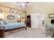 Bedroom featuring a luxurious four-poster bed, neutral walls, and an adjacent office space at 343 Raleigh Pl, Oviedo, FL 32765
