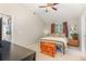 Bedroom with high ceilings, neutral walls, a comfy bed, and a ceiling fan at 343 Raleigh Pl, Oviedo, FL 32765