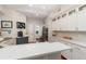 Bright kitchen with white cabinets, quartz countertops, and stainless steel appliances at 343 Raleigh Pl, Oviedo, FL 32765