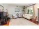 Elegant living room with a piano, stylish seating, and a view of the outdoors at 343 Raleigh Pl, Oviedo, FL 32765