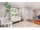 Bright living room featuring hardwood floors, a white sofa, and large windows at 343 Raleigh Pl, Oviedo, FL 32765