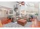 Open-concept living room showcasing wood floors, vaulted ceilings, and a spiral staircase at 343 Raleigh Pl, Oviedo, FL 32765