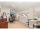 Upstairs office space with neutral walls, carpet, and a desk at 343 Raleigh Pl, Oviedo, FL 32765