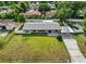 An aerial view shows a well-kept single Gathering home and spacious front lawn at 4604 S Shore Rd, Orlando, FL 32839