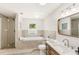 Spa-like bathroom featuring a soaking tub, walk-in shower, and modern vanity at 4604 S Shore Rd, Orlando, FL 32839