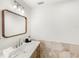 Bathroom featuring a vanity with a wooden-framed mirror and tiled backsplash at 4604 S Shore Rd, Orlando, FL 32839